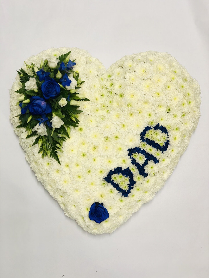 <h2>Bespoke Personalised Heart-Shaped Design | Funeral Flowers</h2>
<ul>
<li>Approximate Size W 50cm H 50cm</li>
<li>Hand created personalised white heart in fresh flowers</li>
<li>To give you the best we may occasionally need to make substitutes</li>
<li>Funeral Flowers will be delivered at least 2 hours before the funeral</li>
<li>For delivery area coverage see below</li>
</ul>
<br>
<h2><br />Liverpool Flower Delivery</h2>
<p>We have a wide selection of Funeral Hearts offered for Liverpool Flower Delivery. Funeral Hearts can be provided for you in Liverpool, Merseyside and we can organize Funeral flower deliveries for you nationwide. Funeral Flowers can be delivered to the Funeral directors or a house address. They can not be delivered to the crematorium or the church.</p>
<br>
<h2>Flower Delivery Coverage</h2>
<p>Our shop delivers funeral flowers to the following Liverpool postcodes L1 L2 L3 L4 L5 L6 L7 L8 L11 L12 L13 L14 L15 L16 L17 L18 L19 L24 L25 L26 L27 L36 L70 If your order is for an area outside of these we can organise delivery for you through our network of florists. We will ask them to make as close as possible to the image but because of the difference in stock and sundry items, it may not be exact.</p>
<br>
<h2>Liverpool Funeral Flowers | Hearts</h2>
<p>This beautiful classic heart-shaped design covered with a mass of white double spray chrysanthemums with a delicate spray of roses and lisanthus can be personalised with either DAD or MUM which can be written in any colour.</p>
<br>
<p>When a heart is sent as a funeral tribute it is symbolic of comfort in ones last resting place. It makes deeply personal statement that is indicative of the love and compassion felt by immediate family or closely bereaved.</p>
<br>
<p>Contents of the product:18 inch heart frame, 20 white chrysanthemums, 2 large-headed roses and 2 lisianthus, together with personalised DAD or MUM in blue or pink.</p>
<br>
<h2>Best Florist in Liverpool</h2>
<p>Trust Award-winning Liverpool Florist, Booker Flowers and Gifts, to deliver funeral flowers fitting for the occasion delivered in Liverpool, Merseyside and beyond. Our funeral flowers are handcrafted by our team of professional fully qualified who not only lovingly hand make our designs but hand-deliver them, ensuring all our customers are delighted with their flowers. Booker Flowers and Gifts your local Liverpool Flower shop.</p>
<p><br /><br /></p>
<p><em>Jane Catherine and family - Review by post - Funeral Florist Liverpool</em></p>
<br>
<p><em>Thank you so much for the amazing flowers you arranged for our mum she would have loved them. Love Jane, Catherine and family</em></p>